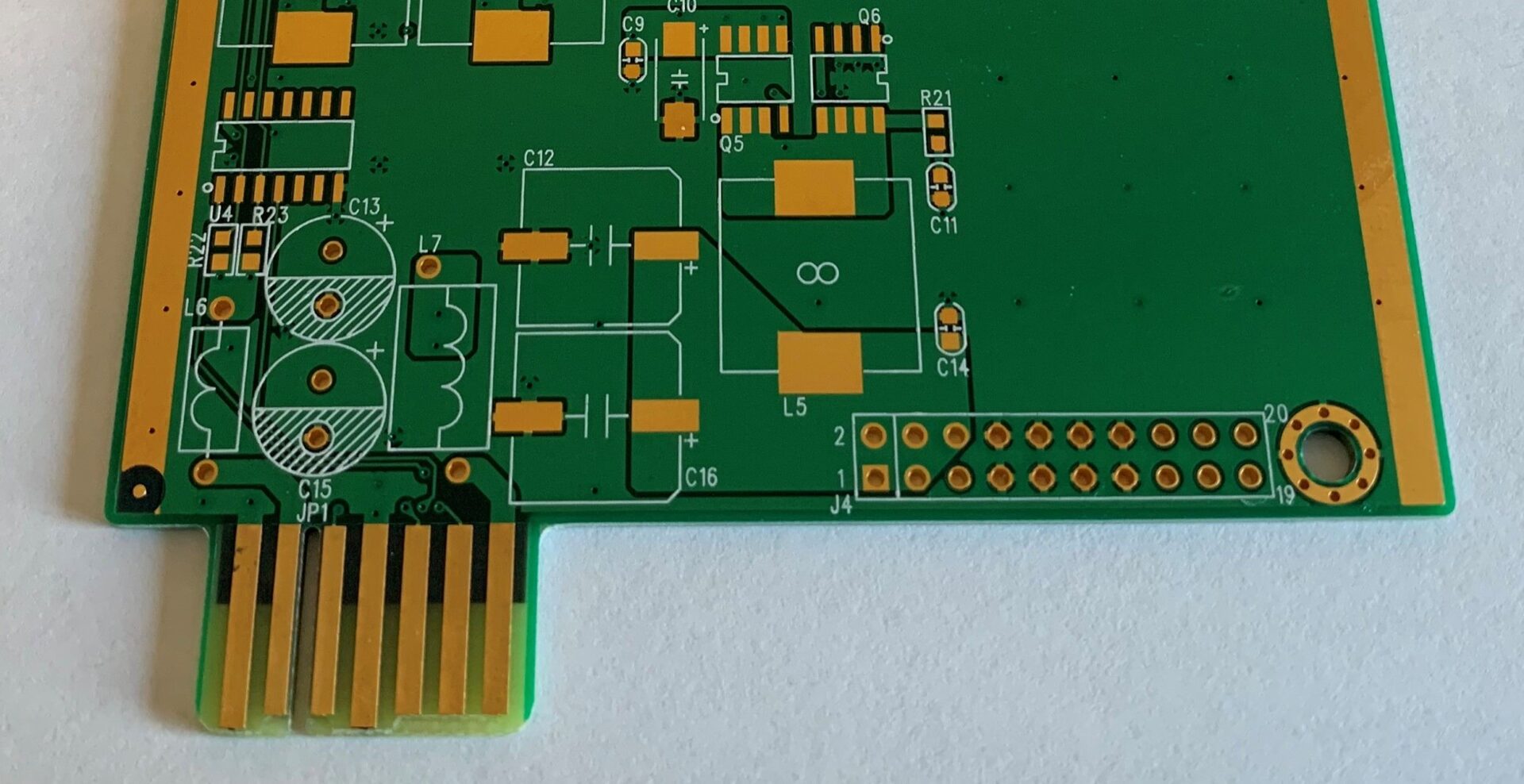 A close up of the bottom edge of a printed circuit board